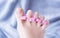 Woman preparing for  foot pedicure at home by herself with nail separators