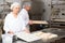 Woman preparing formed dough for proofing