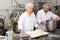 Woman preparing formed dough for proofing