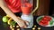 Woman Preparing Fruit Smoothie in Blender