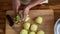 Woman preparing green apples for jam or pie, top view video