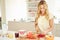 Woman Preparing Healthy Breakfast In Kitchen