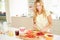 Woman Preparing Healthy Breakfast In Kitchen