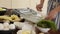 Woman preparing healthy homemade potato gratin