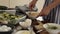 Woman preparing healthy homemade potato gratin