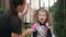 Woman preparing her daughter to halloween. Young cutie girl having fun. happy halloween