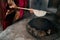 Woman preparing or making borek or bread dough, close-up