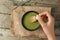 Woman preparing matcha tea, closeup