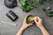 Woman preparing matcha tea at table