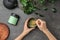 Woman preparing matcha tea at table,