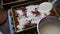 Woman preparing meat lasagna in kitchen