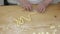 Woman preparing orecchiette e cavatelli with homemade pasta