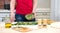 Woman preparing pie with spinach greens and feta cheese, food. C