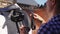 Woman Preparing And Saddling Up The Horse - Tying Up Leather Strap Of The Saddle