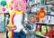 Woman preparing to fest and choosing clown wig