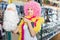 Woman preparing to fest and choosing clown wig