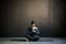 Woman preparing to practice yoga, sitting on meditation session