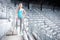 Woman preparing for training on stadium, stairs and fitness training - cross fit workout and running