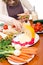 Woman preparing vegetable sandwiches