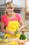 Woman preparing vegetables salad peeling cucumber