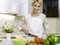 Woman preparing vegetarian salad