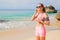 Woman preparing for workout on the beach