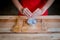 Woman prepeared eggs for cooking on wooden table