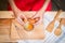 Woman prepeared eggs for cooking on wooden table