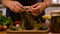 A woman is preserving vegetables in the kitchen. Selective focus.