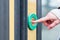 Woman pressing door opener in train