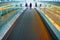 Woman pressing the moving walkways and stroller