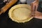 Woman pressing tart dough on mold