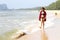 Woman pretty bikin and hat relax daylight on beach