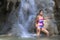 Woman pretty body big with bikini in waterfall