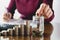 Woman process and drop coin into the glass with stack coins