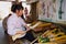 Woman produces traditional Chinese fan in Yangshuo, China.