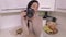 Woman with professional camera take pictures in kitchen