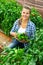 Woman professional horticulturist during harvesting of green peppers