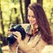 Woman is a professional photographer with photo camera