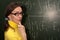 Woman professor student chalk board