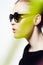 Woman, profile with sunglasses for fashion and light streak, cosmetics or makeup, creativity and neon glow on white