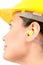 Woman with protective equipment and earplugs