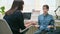 Woman psychologist, counselor talking with girl child