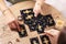 Woman pulling one tarot card at table indoors, closeup. Fortune telling