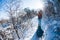 A woman pulls a sled with a child