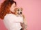 woman with puppy American Staffordshire Terrier posing in studio