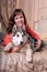 Woman with a puppy Malamute