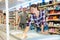 Woman purchasing frozen food in grocery store