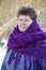 Woman with purple knitted shawl on his shoulders