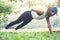Woman push-up exercise workout fitness doing outside on grass i